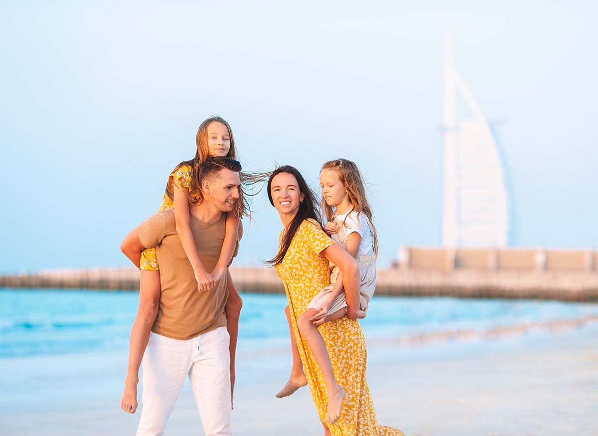 Happy family on the beach during summer vacation