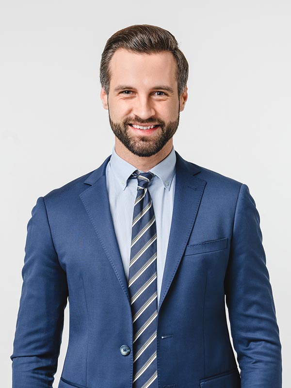 Portrait of handsome caucasian man in formal suit looking at camera smiling with toothy smile isolated in white background. Confident businessman ceo boss freelancer manager
