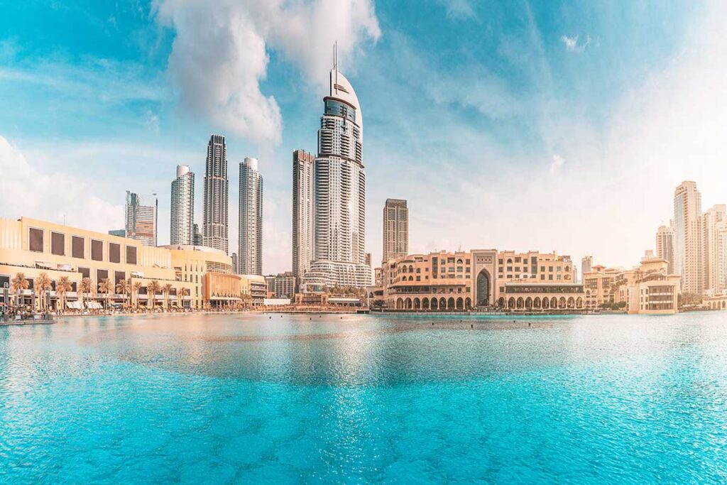 Water pond near the entrance to Dubai Mall and on promenade embankment with skyscrapers in the background